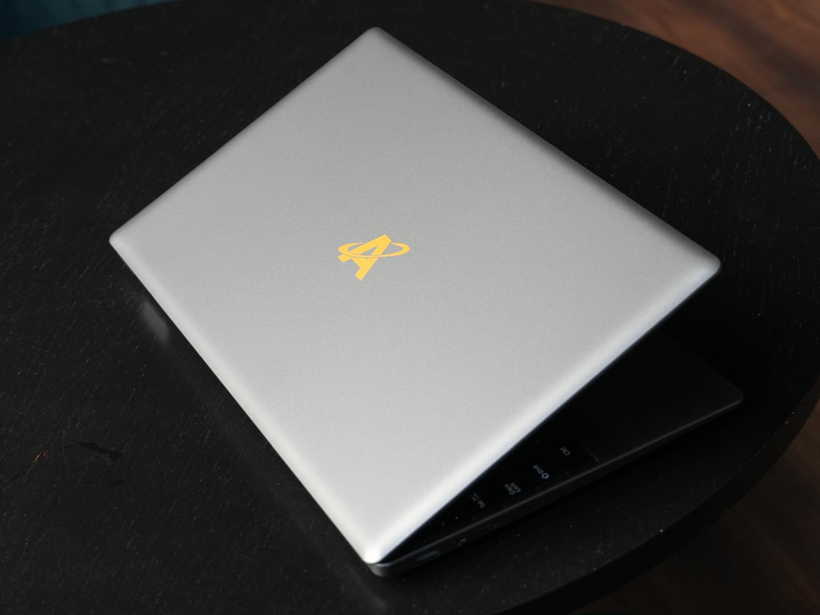 Alfera laptop — closed lid, gold logo